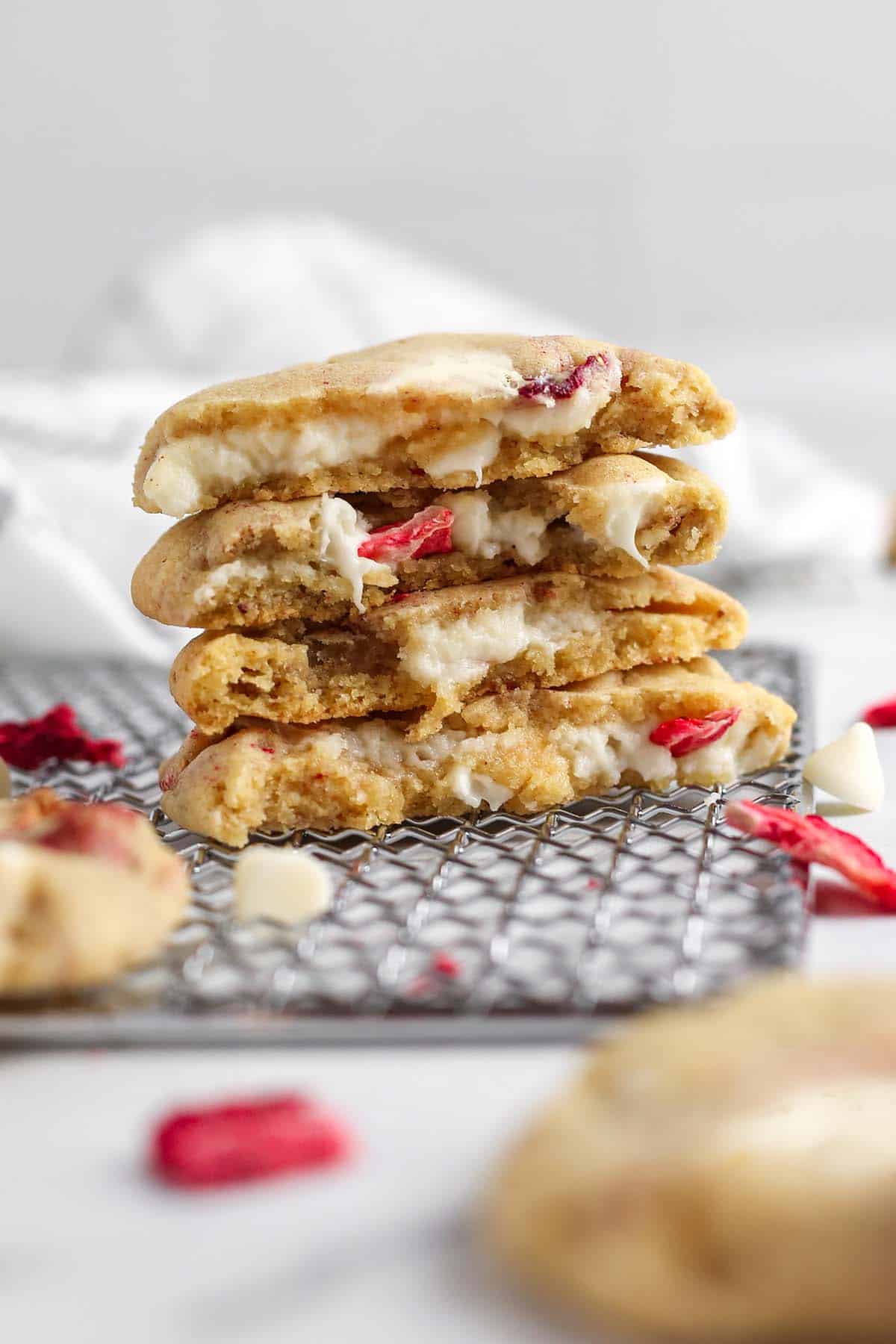 A stack of cookies on a wire rack.