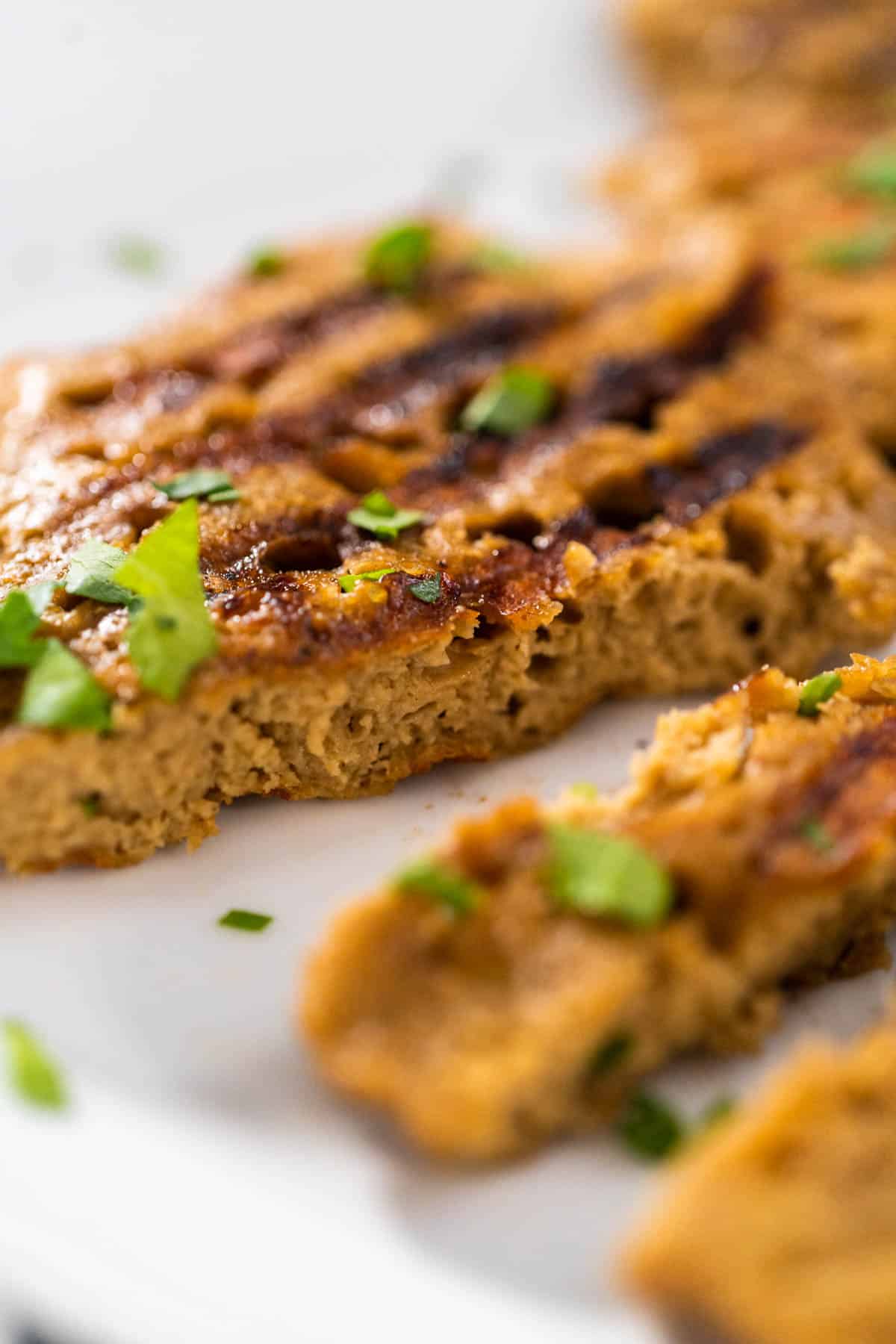 A close up of a seitan chicken cutlet to show the texture.