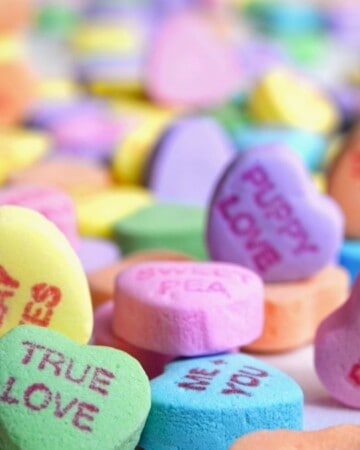 pile of heart shaped candies.
