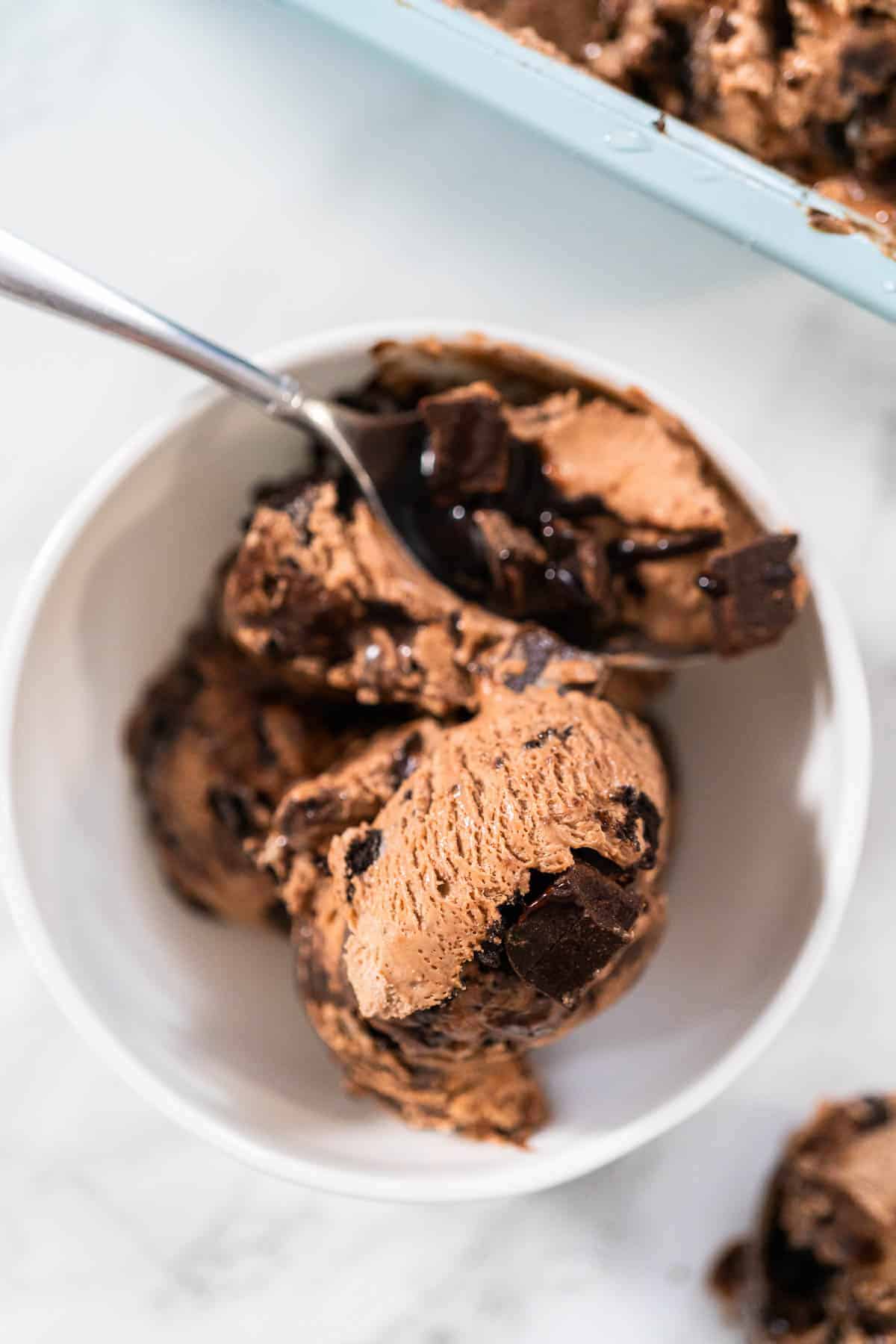 A bowl of Mississippi mud ice cream with a spoon in it.