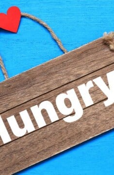 wood sign that reads Hungry_ with heart on the handle.